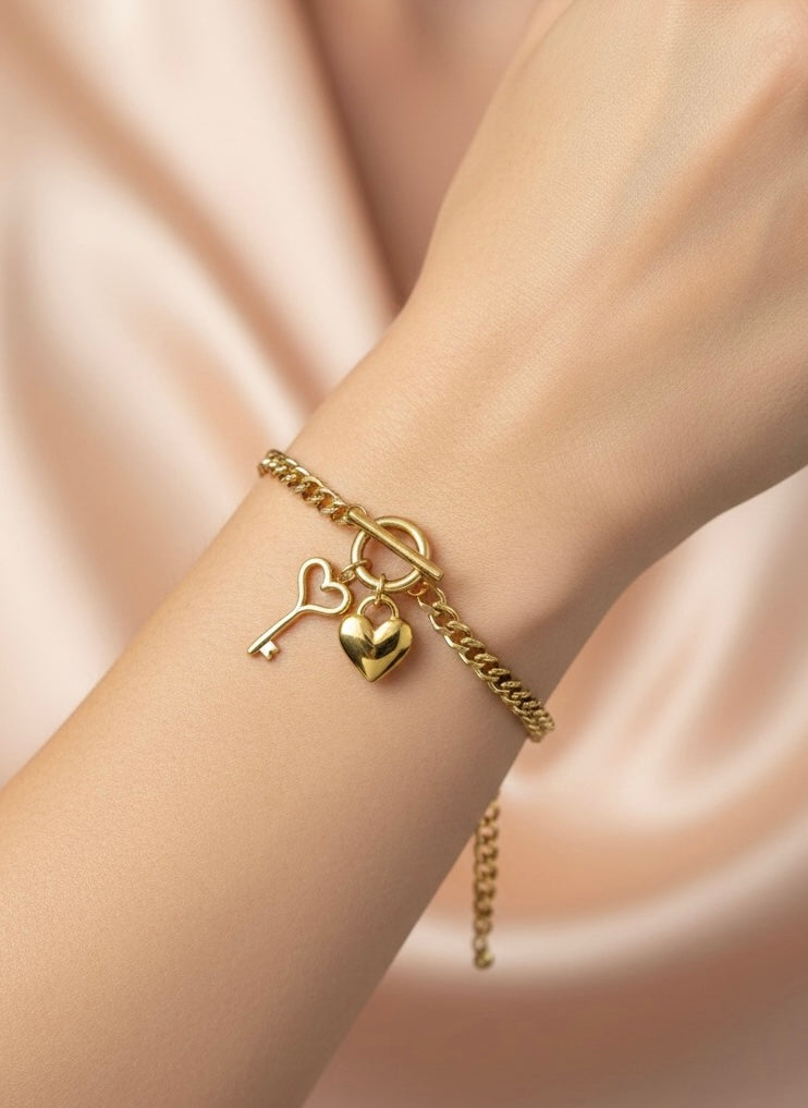 Amaura Golden Charm Link Bracelet On Hand
