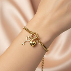 Amaura Golden Charm Link Bracelet On Hand