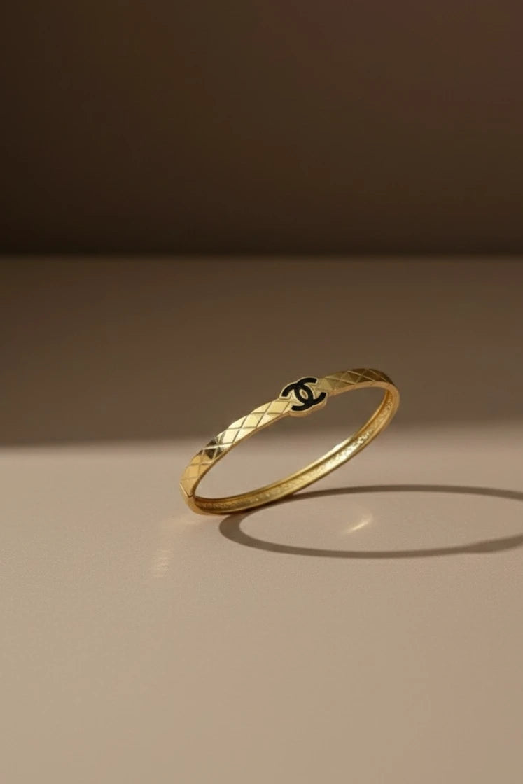 Women wearing golden logo kada
