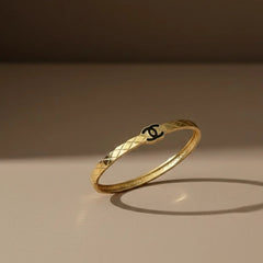 Women wearing golden logo kada
