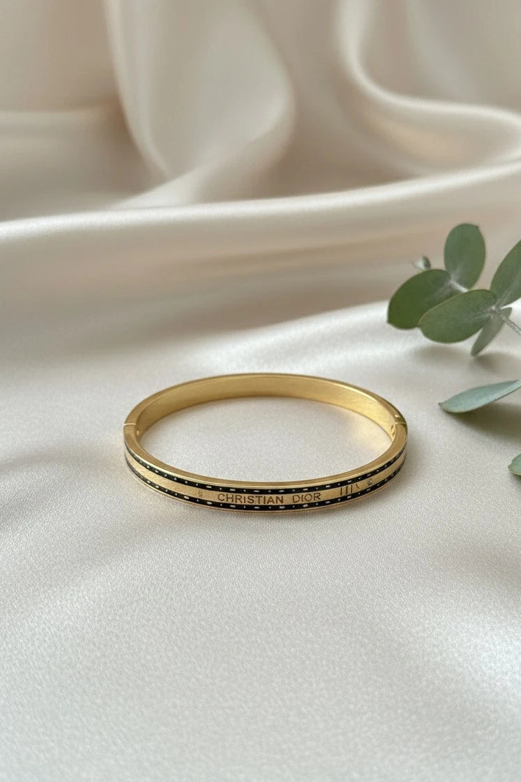 Women wearing black stripe kada
