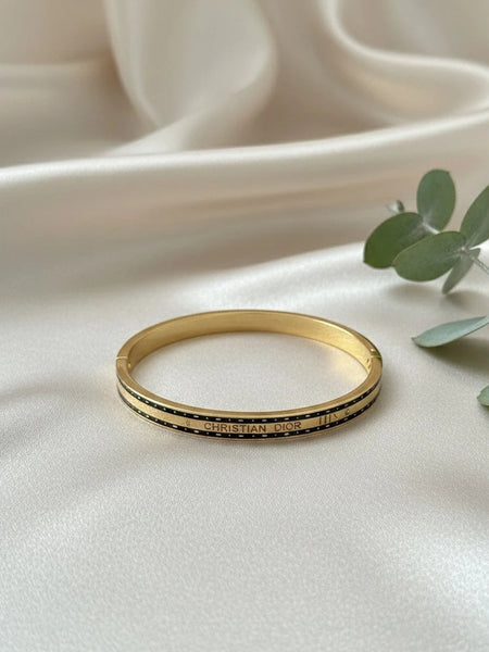 Women wearing black stripe kada
