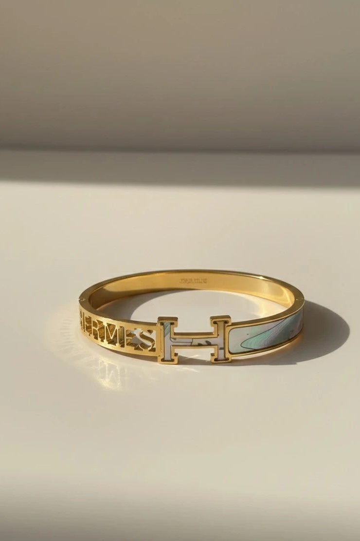 Women wearing golden sea green kada
