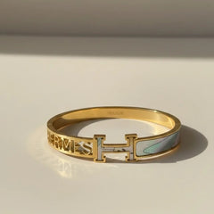 Women wearing golden sea green kada
