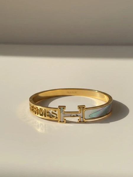 Women wearing golden sea green kada
