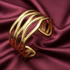 Women wearing golden wave bracelet
