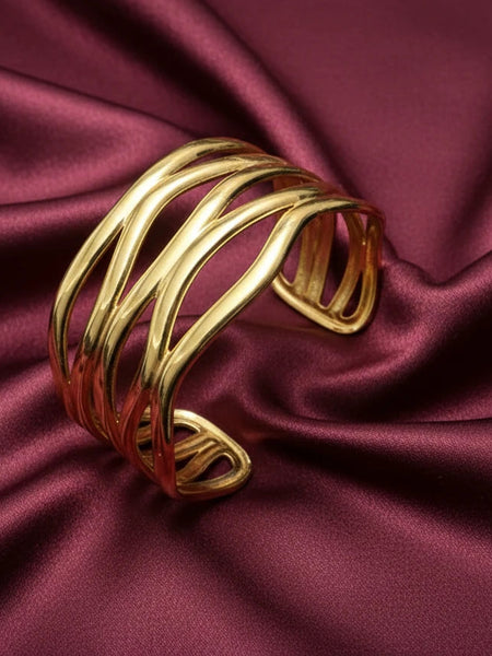 Women wearing golden wave bracelet
