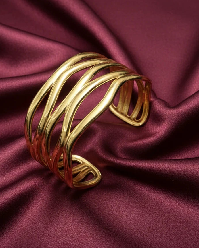Women wearing golden wave bracelet
