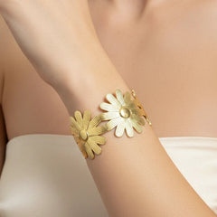 Women wearing golden floral bracelet
